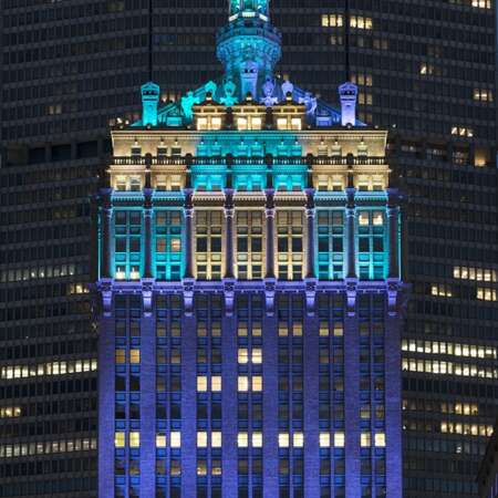 Click to view a popup image of Helmsley building exterior lit up in blue lights