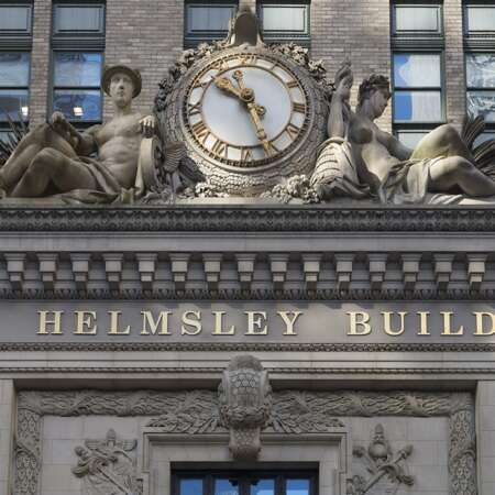 Click to view a popup image of Helmsley building exterior clock above front door