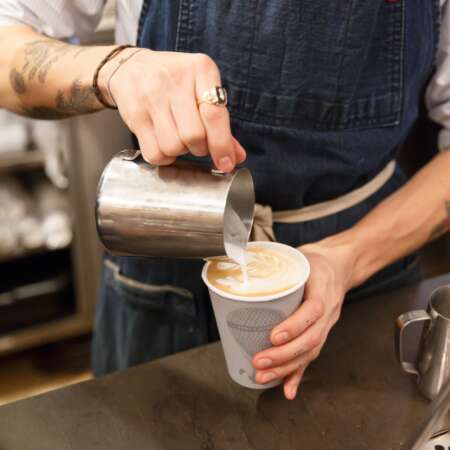 Click to view a popup image of Barista making coffee